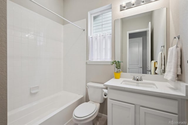 bathroom featuring vanity, bathtub / shower combination, and toilet