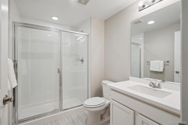 bathroom with visible vents and a shower stall