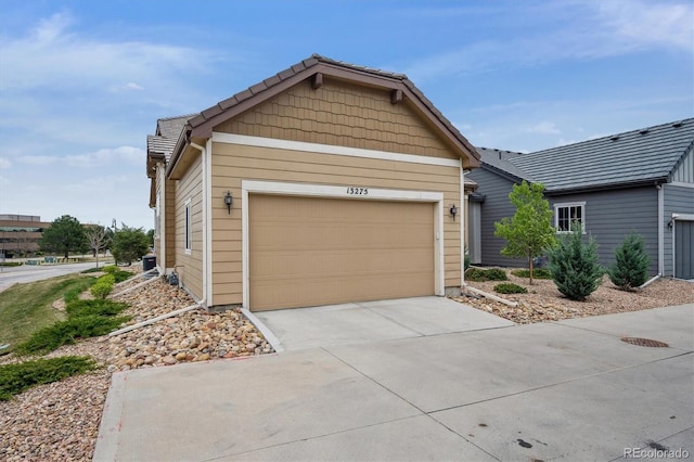 view of front of home featuring a garage and driveway