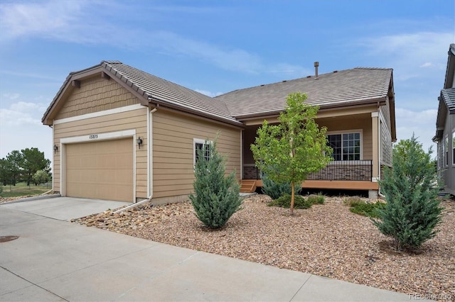 ranch-style home with driveway and a garage