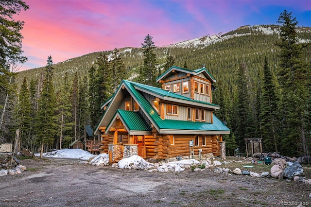 50 Pine St, Empire, CO 80438 - log-style house featuring log siding, a view of trees, a mountain view, and metal roof