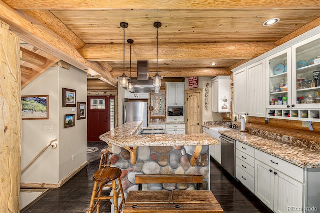 50 Pine St, Empire, CO 80438 - kitchen with stainless steel appliances, dark wood finished floors, recessed lighting, a kitchen island, and white cabinets