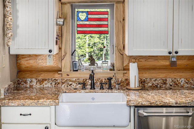 50 Pine St, Empire, CO 80438 - kitchen featuring a sink, dishwasher, white cabinetry, light stone countertops, and tasteful backsplash
