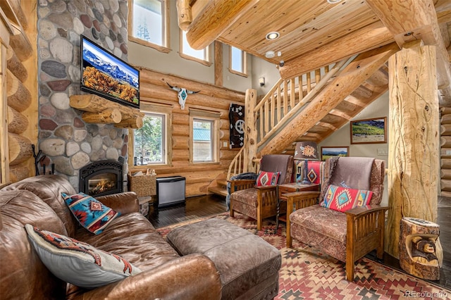 50 Pine St, Empire, CO 80438 - living area with rustic walls, stairway, wood ceiling with exposed beams, a high ceiling, and hardwood / wood-style floors