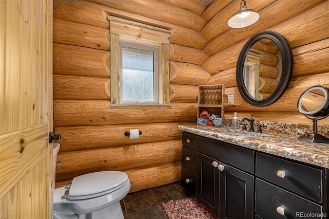 50 Pine St, Empire, CO 80438 - half bathroom featuring vanity, toilet, and log walls