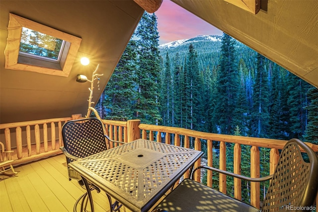 50 Pine St, Empire, CO 80438 - deck featuring outdoor dining area, a mountain view, and a view of trees