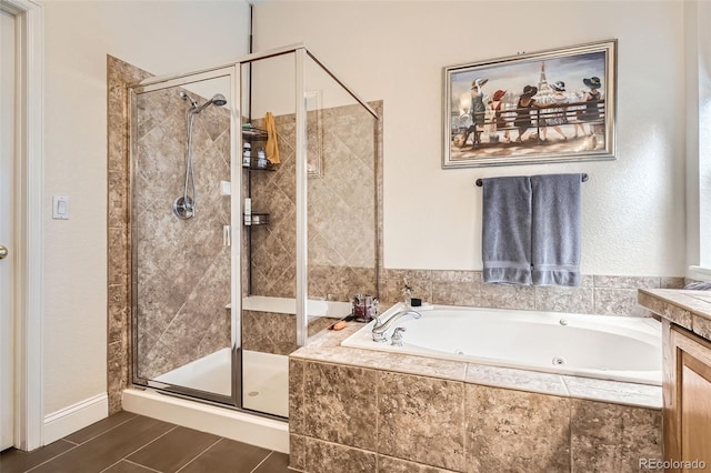 full bath featuring a shower stall, a tub with jets, and vanity