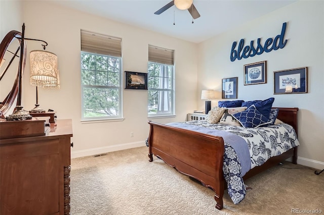 bedroom featuring baseboards, carpet floors, and ceiling fan