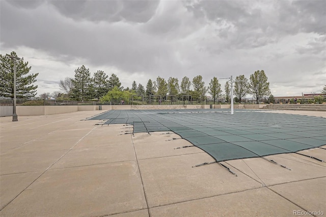 community pool featuring fence