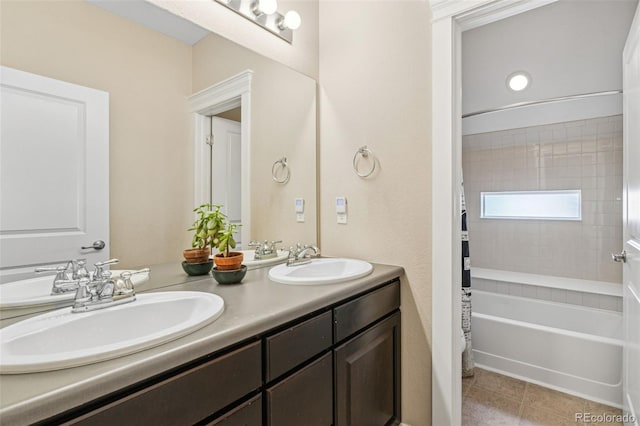 full bathroom with shower / tub combo with curtain, tile patterned flooring, a sink, and double vanity