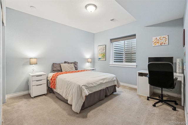 bedroom featuring light carpet, visible vents, and baseboards