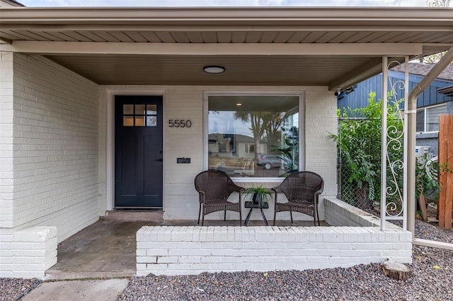 property entrance featuring covered porch