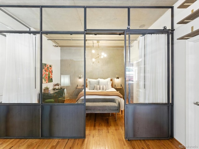 1499 Blake St Unit 3U, Denver, CO 80202 - bedroom featuring wood finished floors