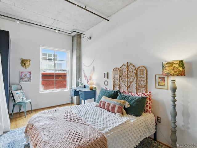 1499 Blake St Unit 3U, Denver, CO 80202 - bedroom featuring wood finished floors