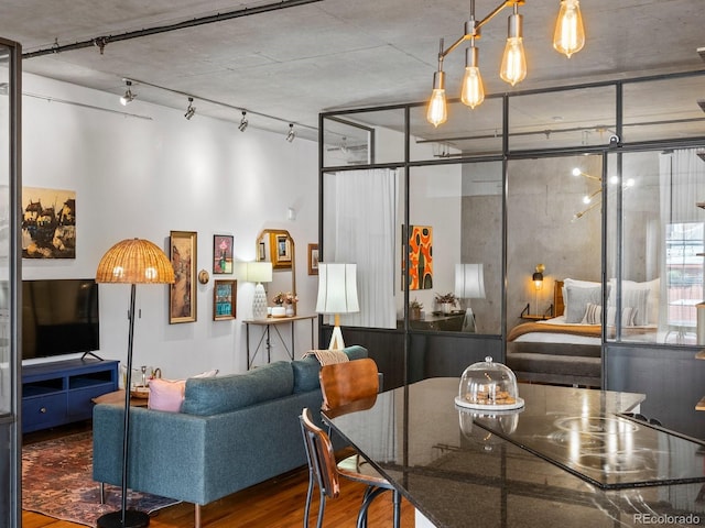 1499 Blake St Unit 3U, Denver, CO 80202 - dining space with wood finished floors and rail lighting
