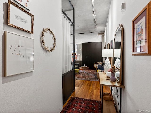 1499 Blake St Unit 3U, Denver, CO 80202 - corridor with wood finished floors and rail lighting