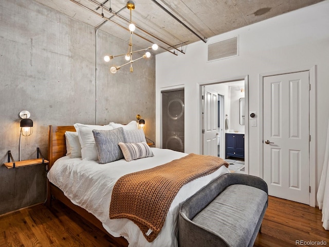 1499 Blake St Unit 3U, Denver, CO 80202 - bedroom featuring wood finished floors, a high ceiling, and ensuite bathroom