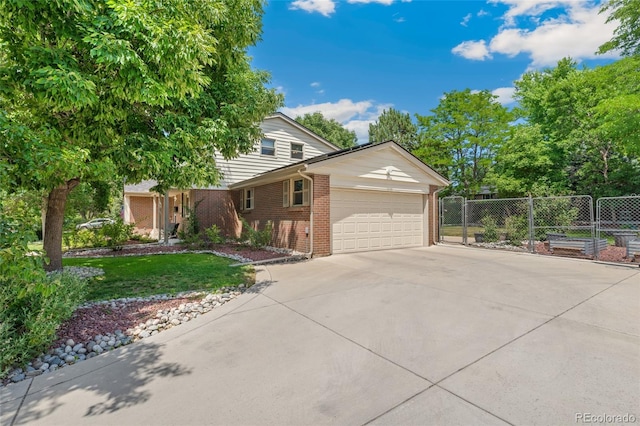 6906 S Sycamore St, Littleton, CO 80120 - view of front of home featuring an attached garage, driveway, and brick siding