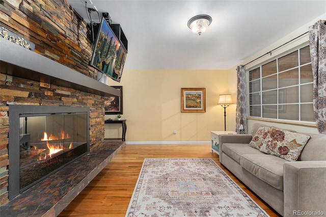 6906 S Sycamore St, Littleton, CO 80120 - living room featuring wood finished floors and a fireplace