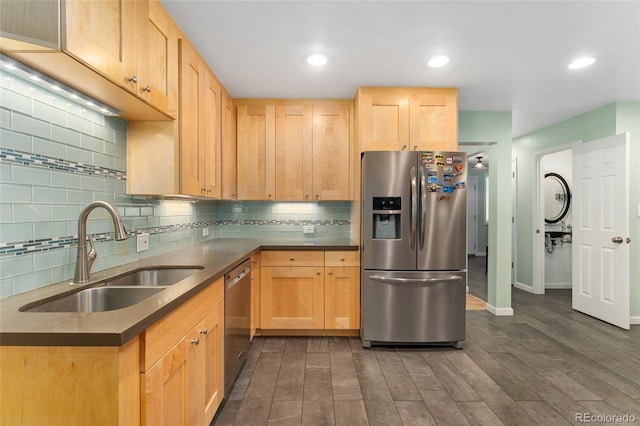 6906 S Sycamore St, Littleton, CO 80120 - kitchen featuring stainless steel appliances, light brown cabinets, decorative backsplash, and recessed lighting