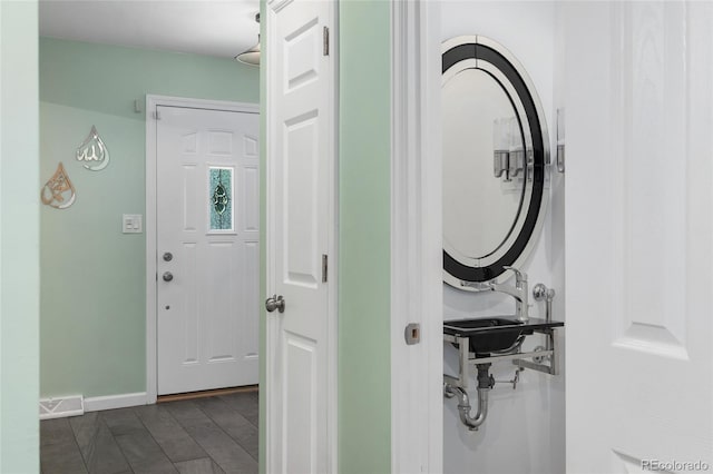 6906 S Sycamore St, Littleton, CO 80120 - laundry area with a sink and baseboards