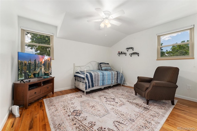 6906 S Sycamore St, Littleton, CO 80120 - bedroom with wood finished floors, lofted ceiling, multiple windows, and ceiling fan