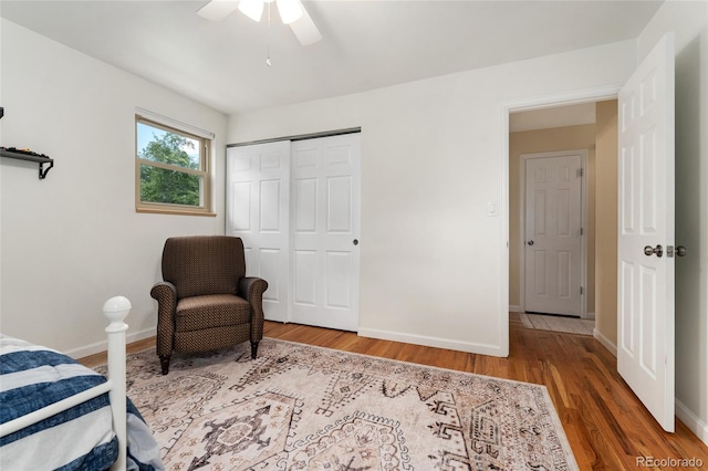 6906 S Sycamore St, Littleton, CO 80120 - bedroom featuring wood finished floors, a closet, and a ceiling fan