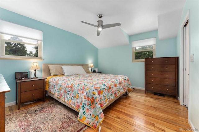 6906 S Sycamore St, Littleton, CO 80120 - bedroom with wood finished floors, vaulted ceiling, and a ceiling fan