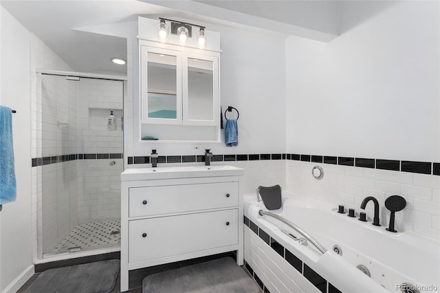 6906 S Sycamore St, Littleton, CO 80120 - bathroom with a whirlpool tub, a shower stall, and vanity