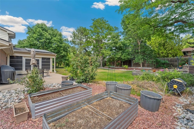 6906 S Sycamore St, Littleton, CO 80120 - view of yard with a garden and a patio area