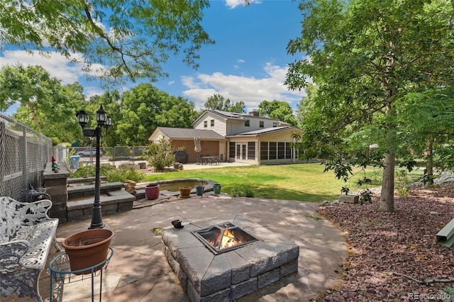 6906 S Sycamore St, Littleton, CO 80120 - view of patio / terrace with an outdoor fire pit