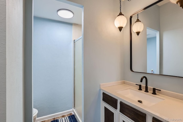 384 S Ironton St Unit 208, Aurora, CO 80012 - full bath with toilet, a stall shower, baseboards, and vanity