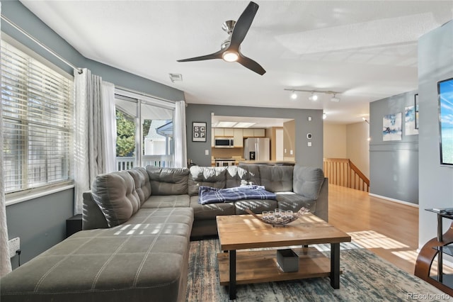 12655 E Pacific Cir Unit C, Aurora, CO 80014 - living room featuring wood finished floors, a ceiling fan, and rail lighting