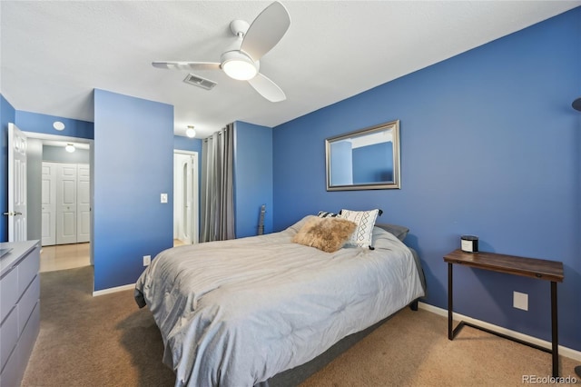 12655 E Pacific Cir Unit C, Aurora, CO 80014 - carpeted bedroom featuring baseboards and ceiling fan