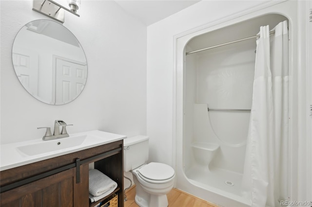 12655 E Pacific Cir Unit C, Aurora, CO 80014 - bathroom with vanity, curtained shower, and wood finished floors