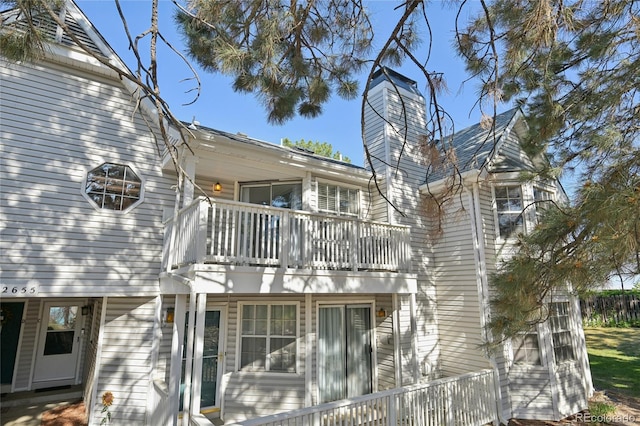 12655 E Pacific Cir Unit C, Aurora, CO 80014 - back of property with a balcony and a chimney