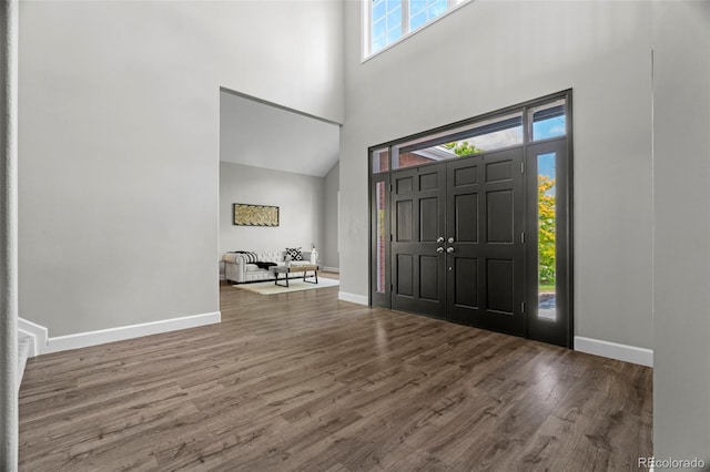 7119 S Riviera St, Aurora, CO 80016 - entrance foyer featuring a towering ceiling and wood finished floors