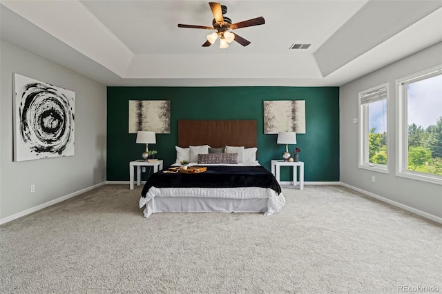 7119 S Riviera St, Aurora, CO 80016 - carpeted bedroom with a raised ceiling and ceiling fan