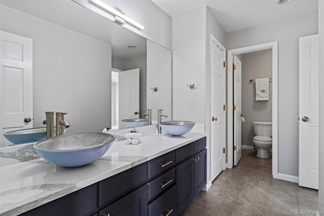 7119 S Riviera St, Aurora, CO 80016 - full bathroom featuring double vanity and tile patterned floors