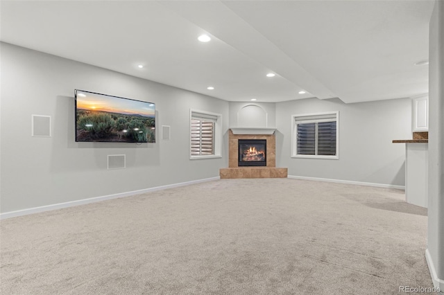 7119 S Riviera St, Aurora, CO 80016 - unfurnished living room featuring a tile fireplace, recessed lighting, and carpet