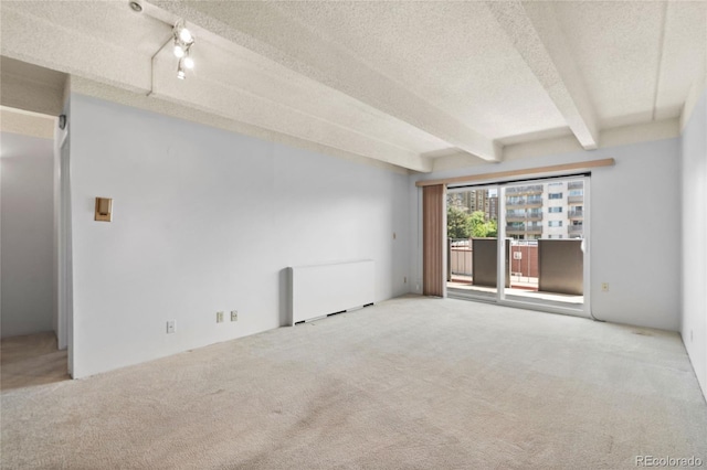 1265 N Race St Unit 603, Denver, CO 80206 - empty room with a textured ceiling, carpet flooring, and beamed ceiling