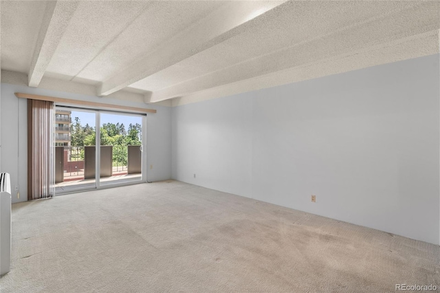 1265 N Race St Unit 603, Denver, CO 80206 - empty room with carpet flooring, beamed ceiling, and a textured ceiling