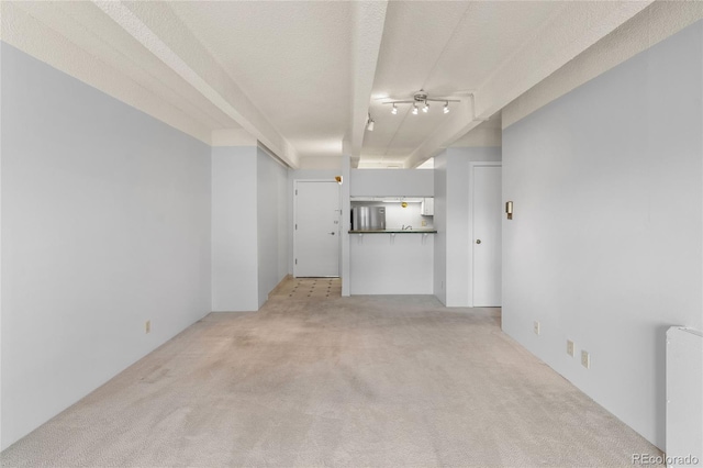 1265 N Race St Unit 603, Denver, CO 80206 - unfurnished living room featuring light carpet and a ceiling fan