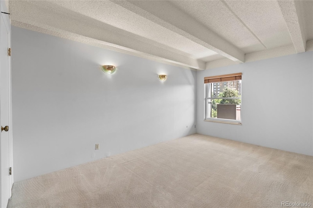 1265 N Race St Unit 603, Denver, CO 80206 - unfurnished room featuring carpet flooring, a textured ceiling, and beamed ceiling