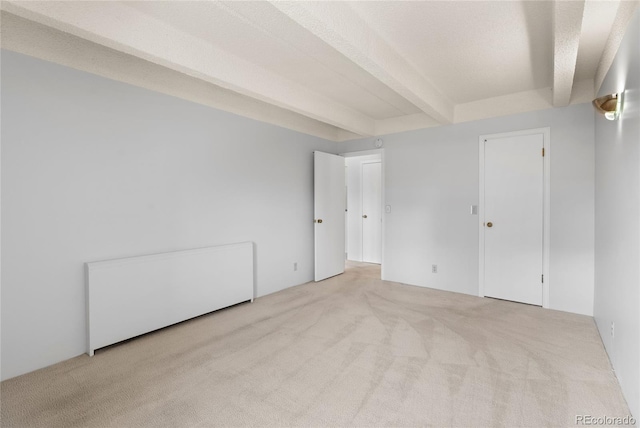 1265 N Race St Unit 603, Denver, CO 80206 - unfurnished bedroom featuring carpet flooring and beamed ceiling