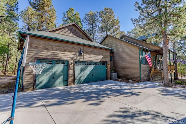 view of side of home with a garage