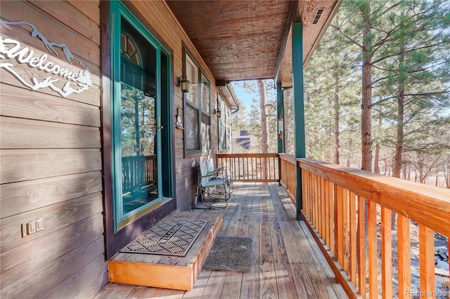 wooden terrace with covered porch