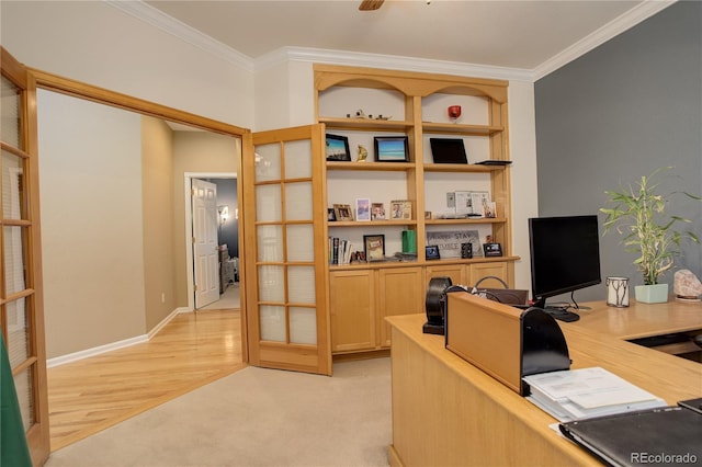 office space featuring french doors, light hardwood / wood-style floors, and ornamental molding