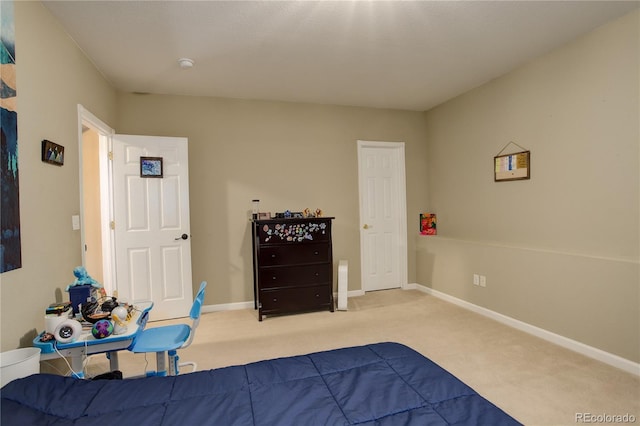 bedroom with light colored carpet