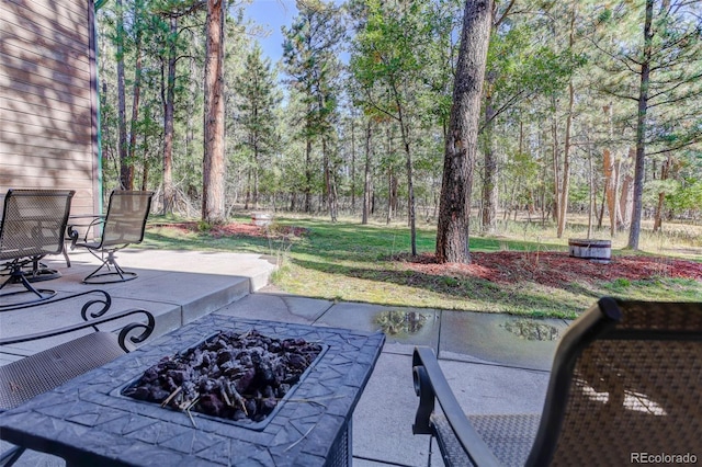 view of patio with an outdoor fire pit